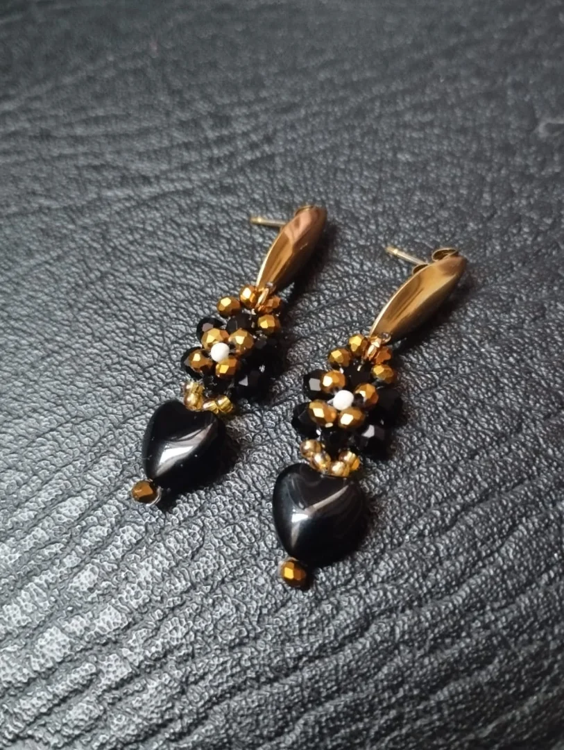 Aretes corazones entrelazados — Quelonios accesorios